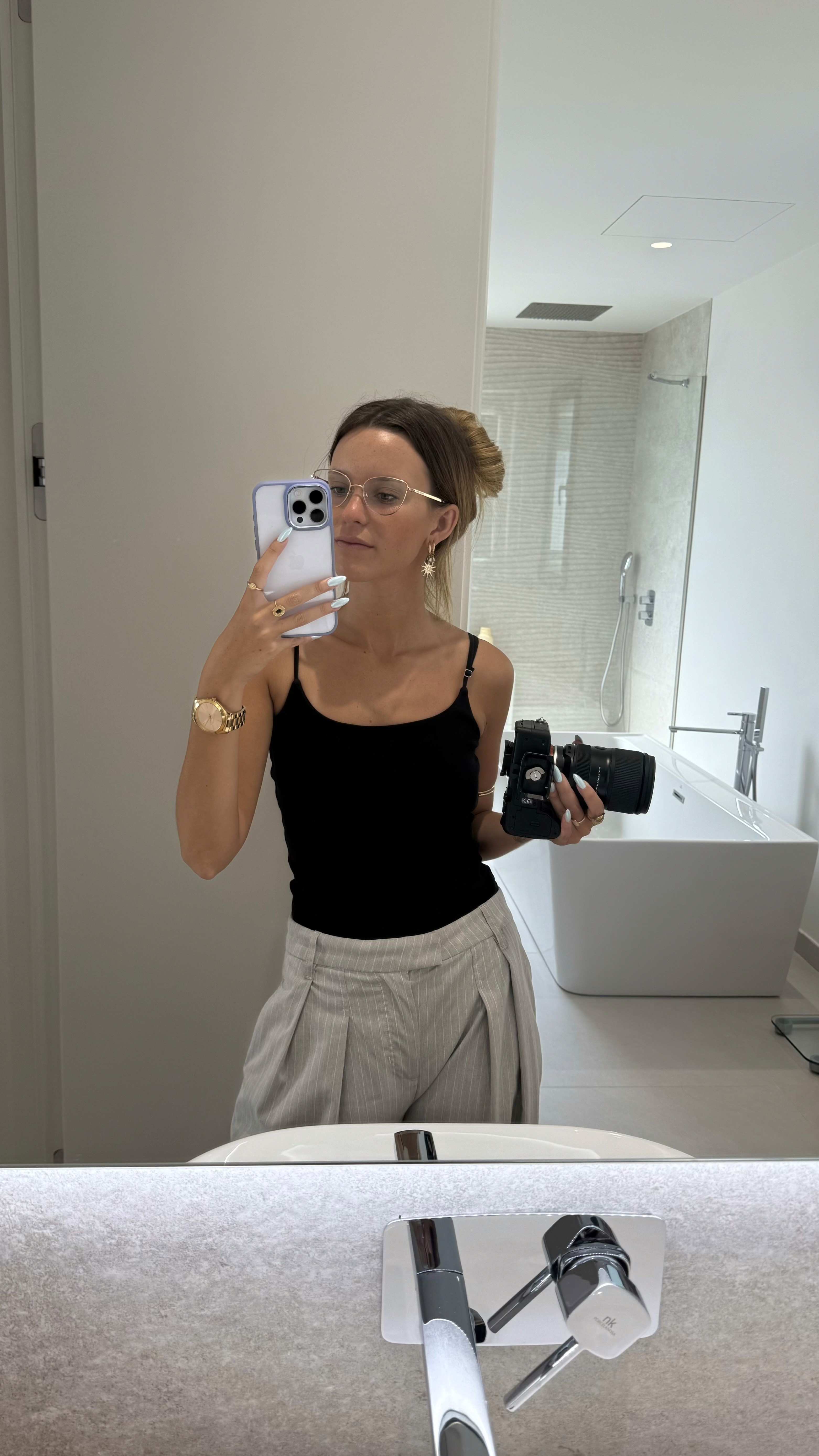 Savannah taking a mirror selfie with her camera