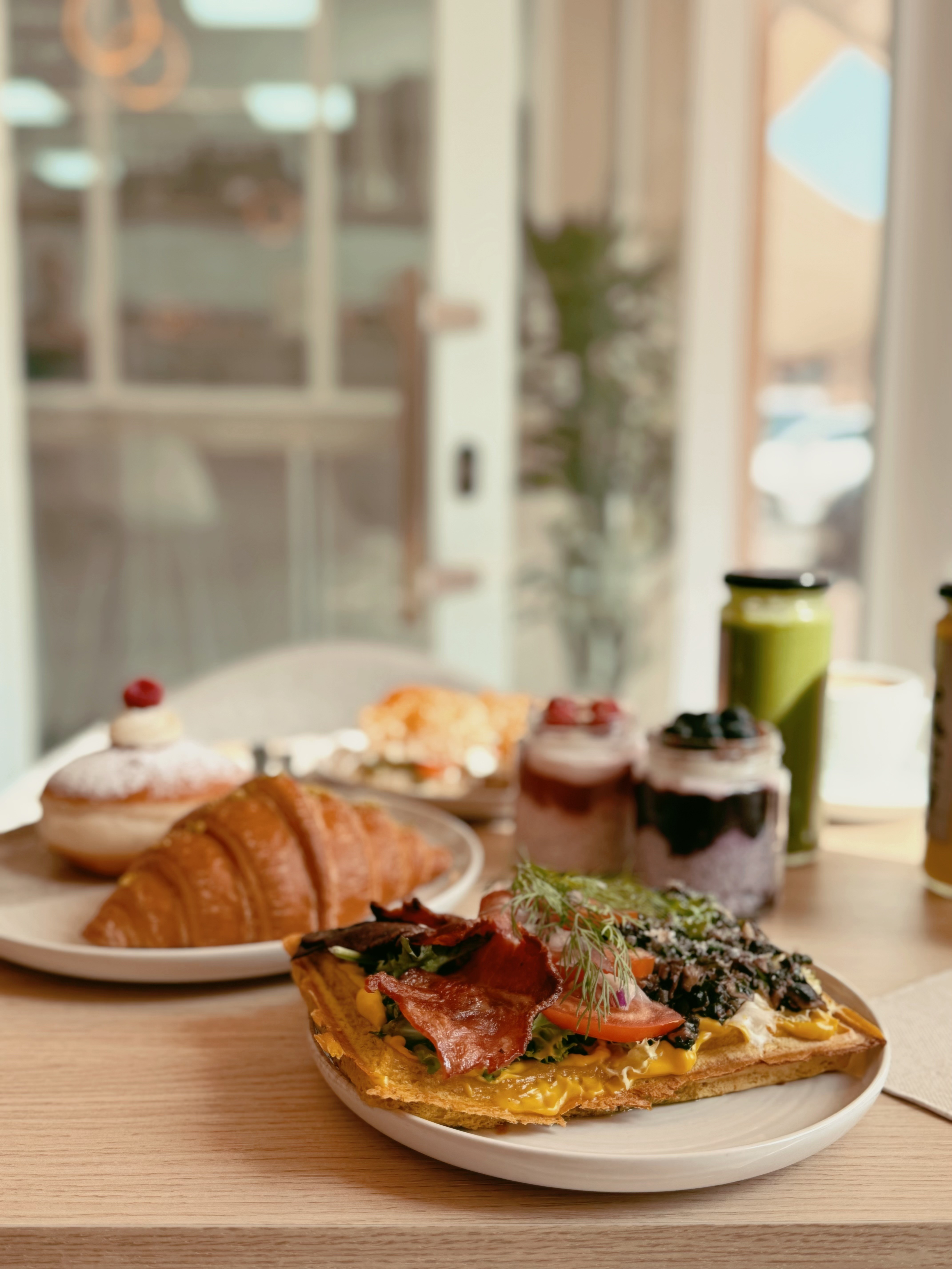Brunch spread with pastries, waffles and fresh juices